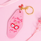 pink motel style keychain with cherry illustration and bow, “i’m literally just a girl” text, rhinestone details and gold key ring on pink background