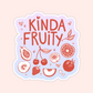 A playful pastel sticker with the phrase “Kinda Fruity” surrounded by red line-art drawings of cherries, strawberries, citrus, and tropical fruits.