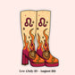 A stylized illustrated pair of tall platform boots with a Leo zodiac theme, shown on a pale pink background. The boots are cream with orange and red flames, purple Leo symbols, and lion heads on the toes.