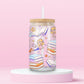 Pink glass tumbler with cartoon Lizzie McGuire reading, surrounded by stacks of pastel books, open pages, hearts, flowers, and stars — perfect for your inner Y2K bookworm.
