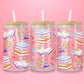 Pink glass tumbler with cartoon Lizzie McGuire reading, surrounded by stacks of pastel books, open pages, hearts, flowers, and stars — perfect for your inner Y2K bookworm.