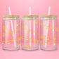 Pink glass can tumbler featuring gold charm chains with hearts, bows, stars, and the words lucky and sweet.