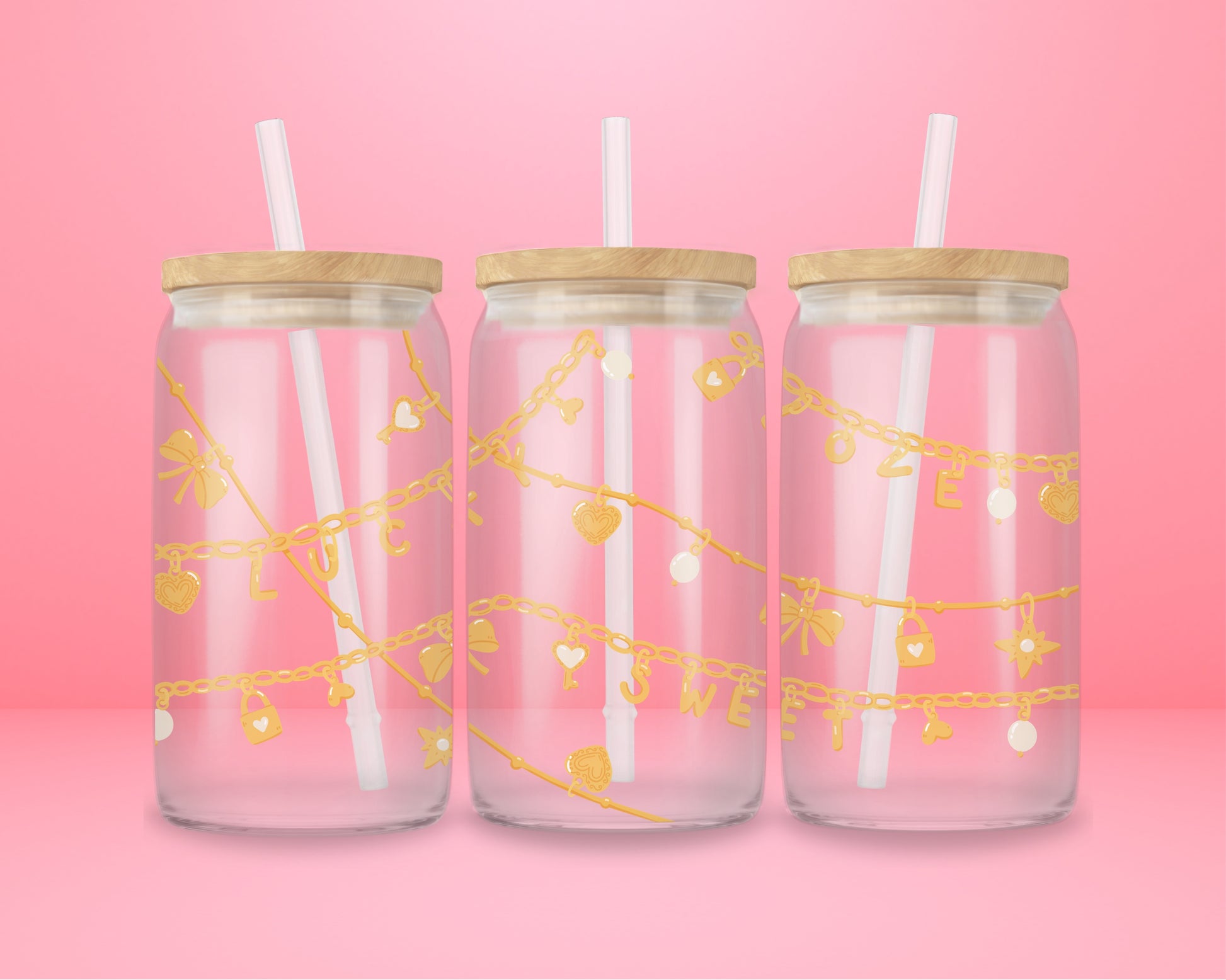 Pink glass can tumbler featuring gold charm chains with hearts, bows, stars, and the words lucky and sweet.