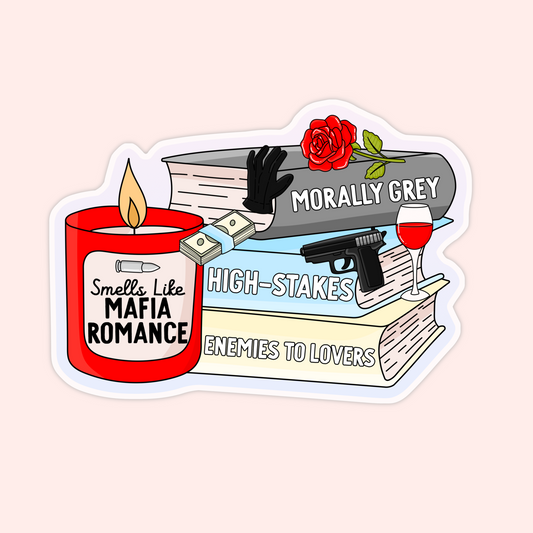 Sticker with books labeled “Morally Grey,” “High-Stakes,” and “Enemies to Lovers” with a red candle that says “Smells Like Mafia Romance,” plus roses, wine, cash, and a gun.