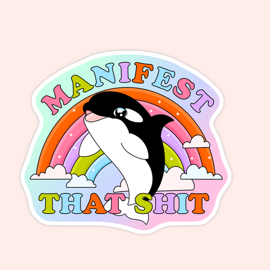 Colorful rainbow sticker with a smiling orca and bold text that says “Manifest That Shit.”