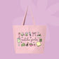 Large pink canvas tote bag featuring the words matcha girlie surrounded by matcha drinks, tea tins, bows, macarons, cake, flowers, and café-inspired doodles.