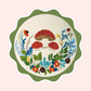 Sticker of original embroidery art featuring red mushrooms, wildflowers, leaves, pinecones, and whimsical woodland details.