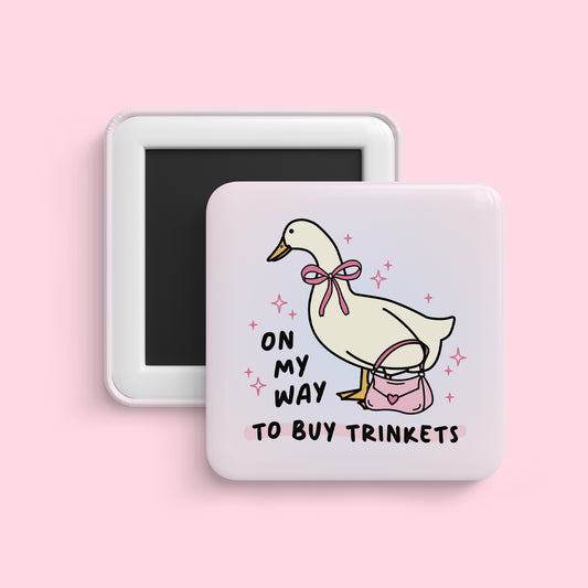 Duck with purse magnet saying on my way to buy trinkets