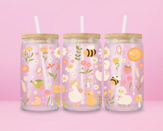 “Pastel floral glass tumbler with bees and blooms – spring picnic aesthetic iced coffee cup.”