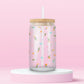 Pink glass tumbler with tiny scattered flowers and bows in a soft spring pattern.