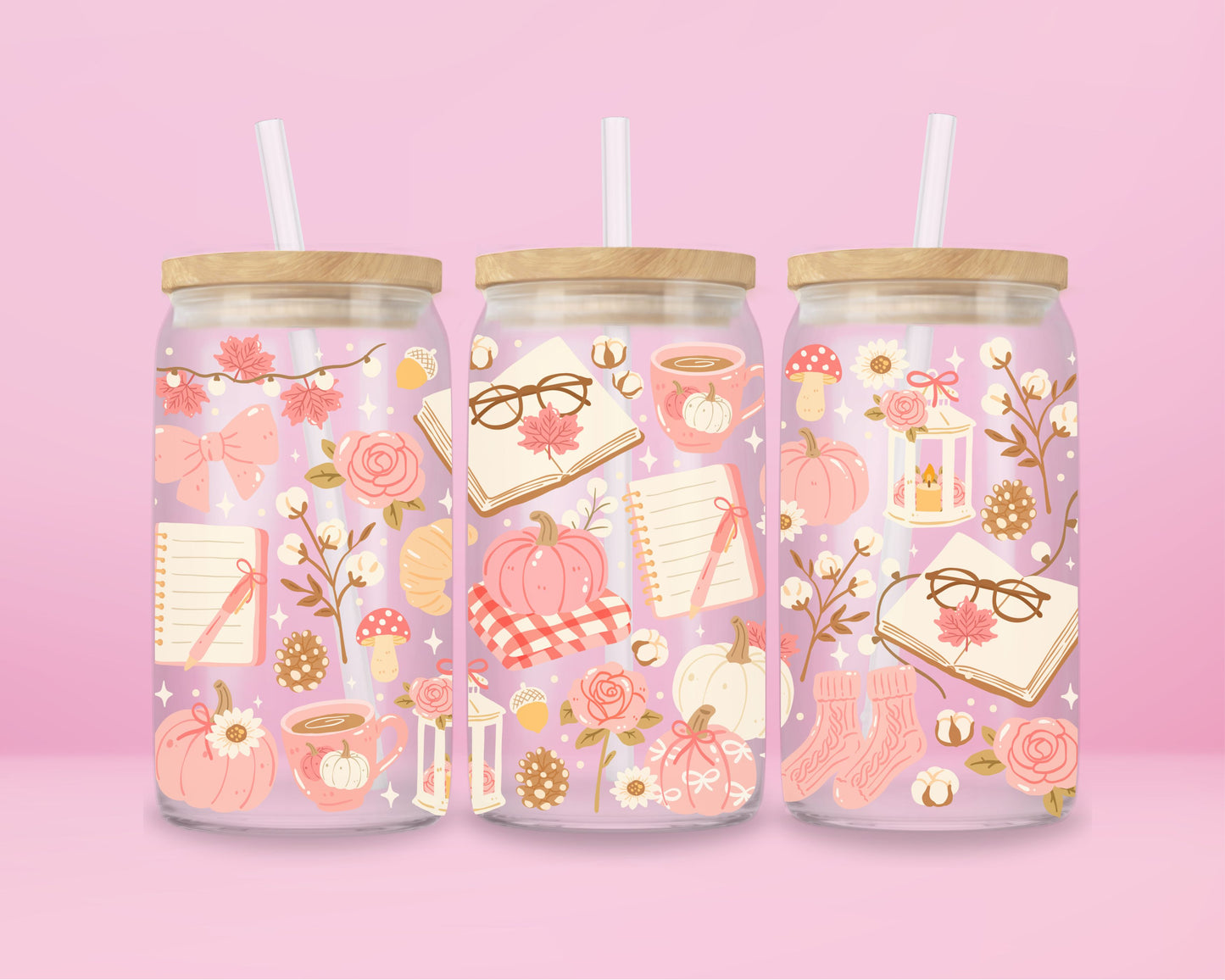  glass tumbler decorated with pumpkins, bows, notebooks, coffee, and florals with bamboo lid and straw.
