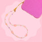 Pink kitty beaded phone wristlet with pearl beads, pink crystal accents, glossy pink cat beads, and soft girlie details.