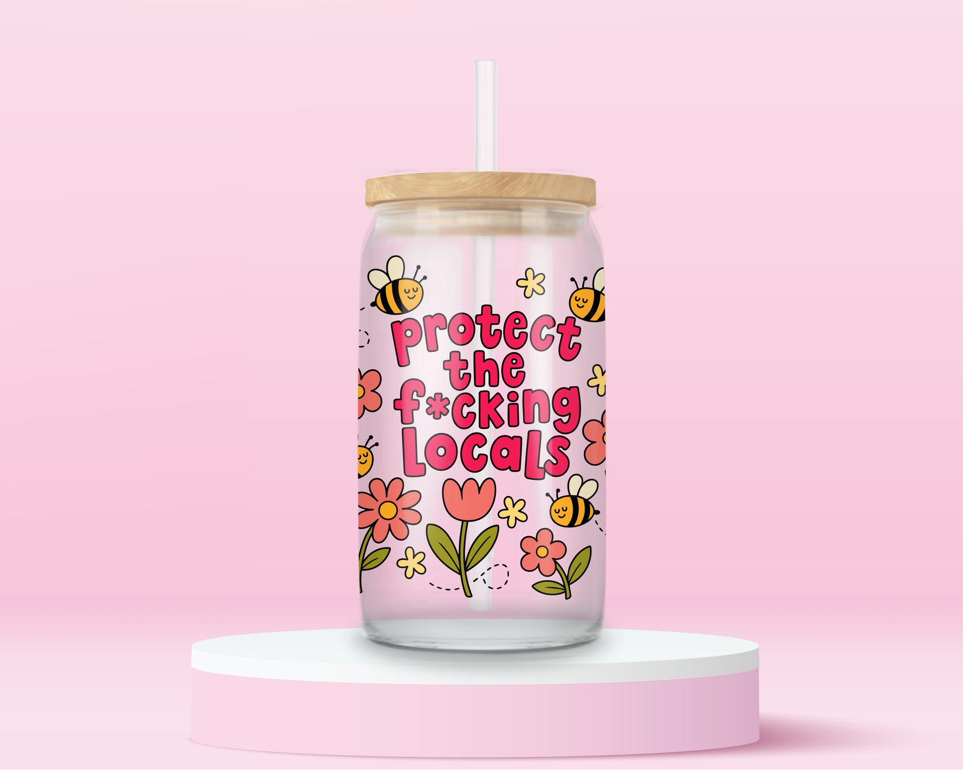 Glass can tumbler with bamboo lid and glass straw featuring flowers, bees, and bold pink text that says Protect The F*cking Locals on a pink background.