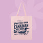 Pink canvas tote bag featuring navy vintage-style text that says Protect Our Stupid Canadian Wolf Birds with a loon and lake illustration.