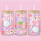 glass tumbler with fantasy details like stacked books, dragon wings, potion bottles, roses, feathers, and crystal balls.
