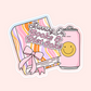 Pink and orange striped book with a bow and a pink soda can that says "Running on Books & Diet Coke."