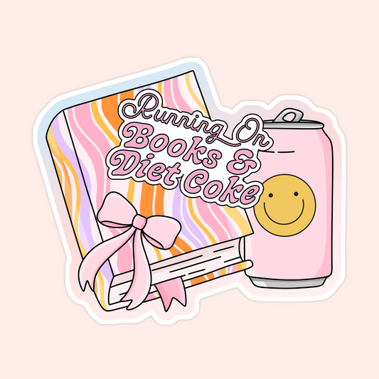 Pink and orange striped book with a bow and a pink soda can that says "Running on Books & Diet Coke."