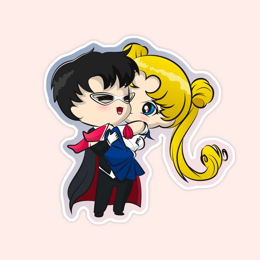 Sticker of chibi-style Sailor Moon being held by Tuxedo Mask in a romantic pose.