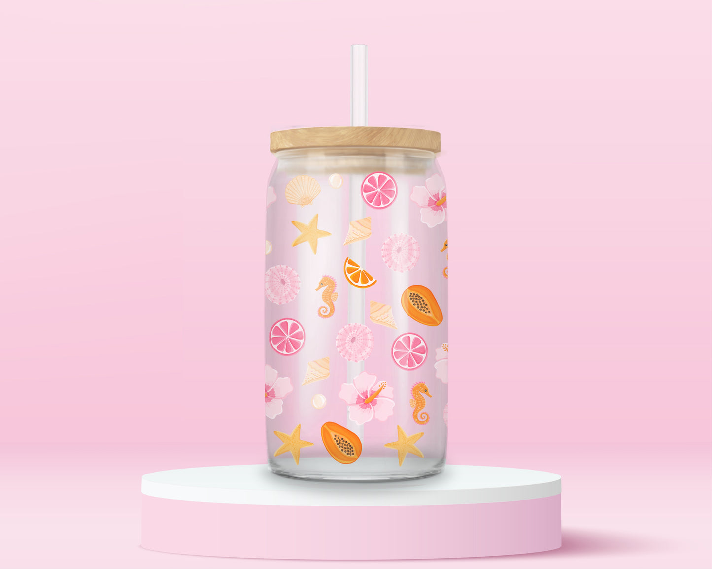 Glass can tumbler with bamboo lid and glass straw featuring seashells, starfish, citrus slices, hibiscus flowers, papaya, pearls, and seahorses on a pink background.