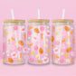 Glass can tumbler with bamboo lid and glass straw featuring seashells, starfish, citrus slices, hibiscus flowers, papaya, pearls, and seahorses on a pink background.
