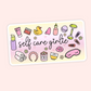 Cute self care girlie sticker with skincare, hair clips, candle, face mask, towels, bath items, flowers, and pastel details.