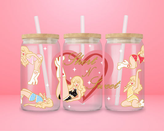 Pink glass tumbler with retro pinup illustrations inspired by Sabrina Carpenter Short N Sweet aesthetic.