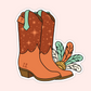A die-cut sticker featuring an illustrated pair of cowboy boots. The boots are brown with star patterns on the shafts, tan lower sections, a mint green pull tab, and decorative feathers in teal, orange, and white.