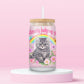 Glass can tumbler with bamboo lid and glass straw featuring a grumpy grey kitten, rainbow, flowers, butterflies, and pink text that says Silently Judging You on a pink background.