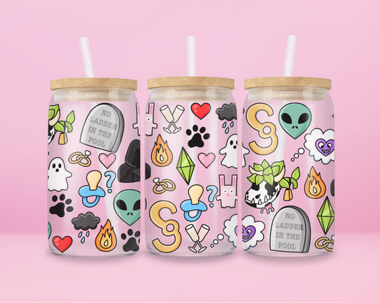 Glass cup with playful Sims-inspired icons including ghosts, plumbobs, gravestones that read “No Ladder in the Pool,” hearts, aliens, skull plants, and colorful objects.