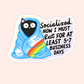 Black cat wrapped in blue blanket with rainbow and text that reads “Socialized. Now I Must Rest For At Least 5-7 Business Days.”