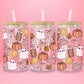 glass tumbler with ghosts, pumpkins, bows, smiley faces, coffee cups, and cozy fall details.