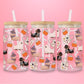 glass tumbler with dachshunds dressed as witches, ghosts, and skeletons alongside pumpkins, whipped lattes, tote bags, and bones.