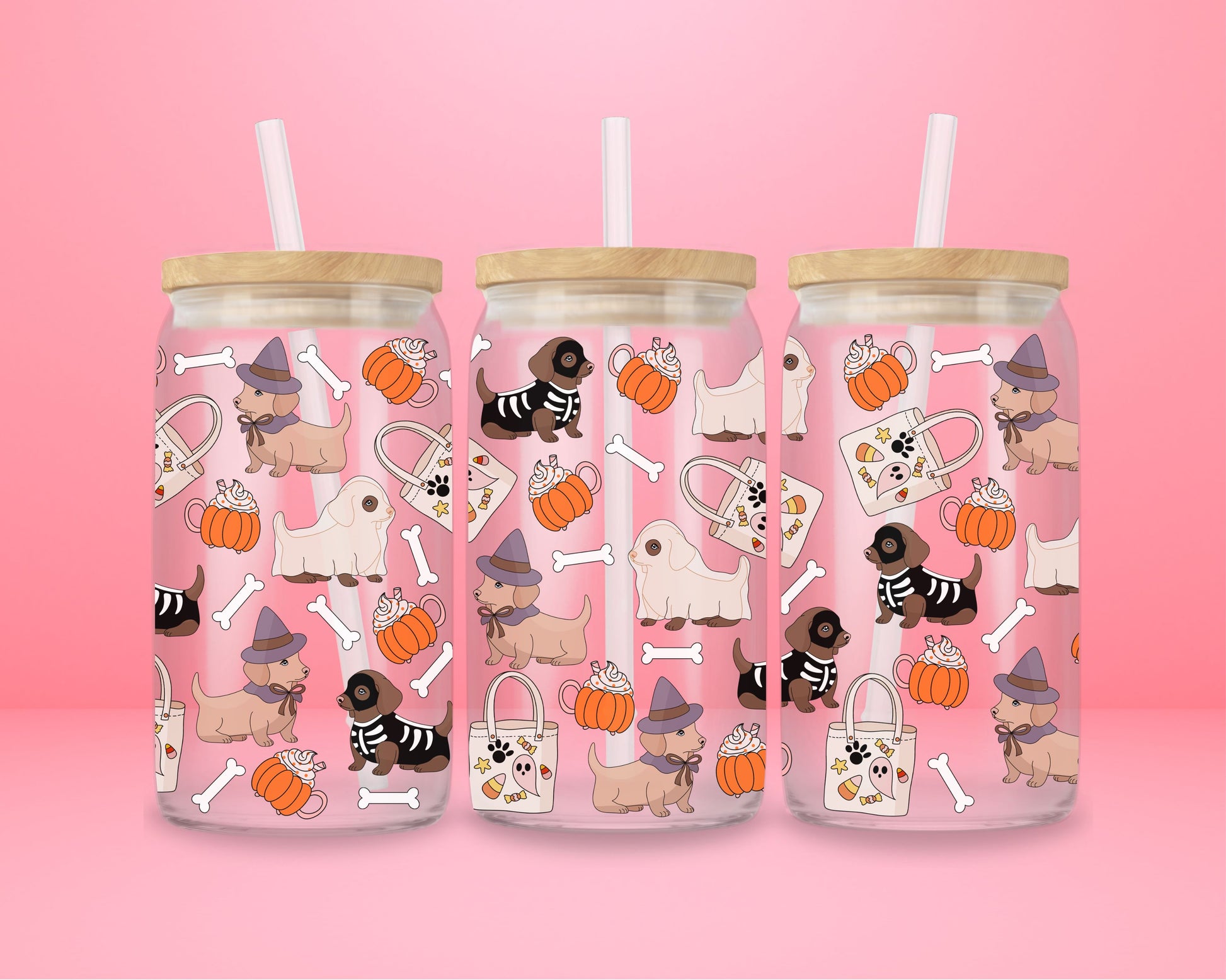 glass tumbler with dachshunds dressed as witches, ghosts, and skeletons alongside pumpkins, whipped lattes, tote bags, and bones.