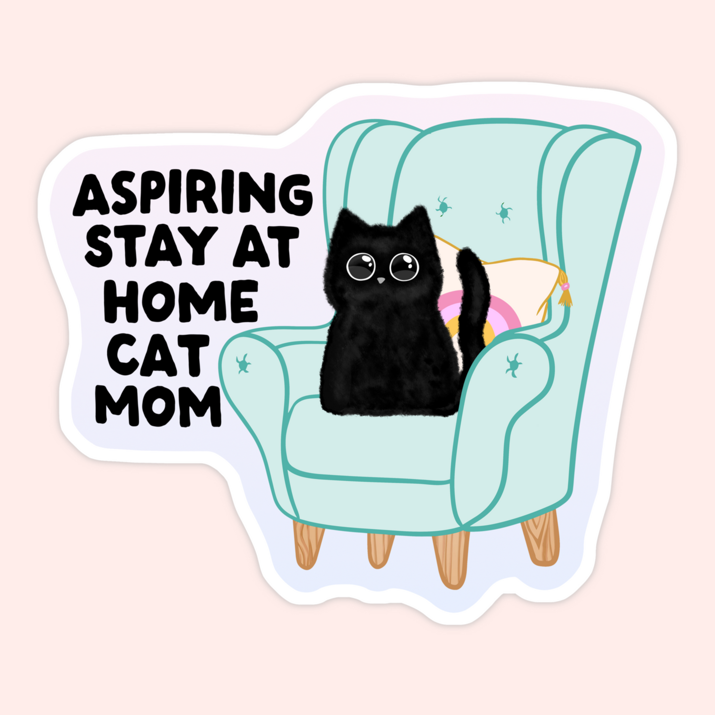 Fluffy black cat sitting in a cozy teal armchair beside the text “Aspiring stay at home cat mom.”