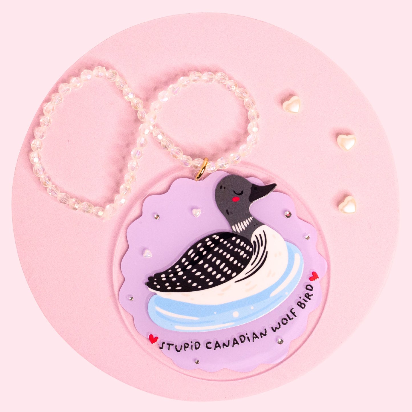 Stupid Canadian Wolf Bird car charm featuring a cute loon on a pastel purple acrylic charm with rhinestones and a handmade beaded hanger.