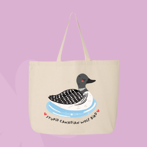 Funny Canadian themed tote bag with illustrated loon floating on water and text reading stupid Canadian wolf bird.