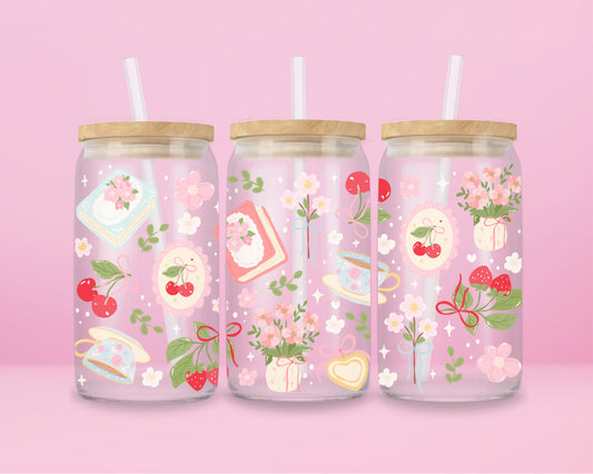 “Romantic glass tumbler with cherry and book details – ideal for readers and tea lovers.”