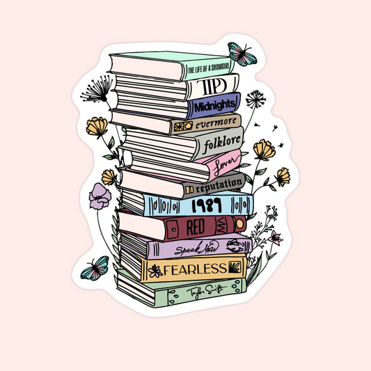 Sticker of a tall stack of books labeled with Taylor Swift albums, decorated with flowers and butterflies.
