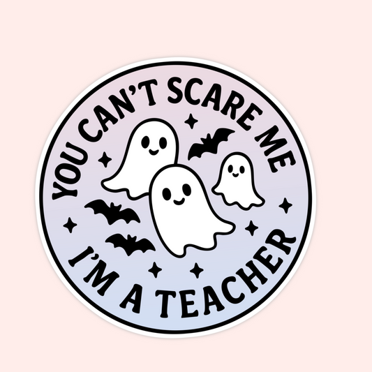 Purple round sticker with smiling ghosts and bats, text says “You can’t scare me, I’m a teacher.”
