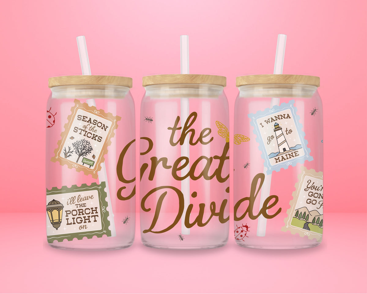16oz glass tumbler with The Great Divide lettering and illustrated postage stamp style details