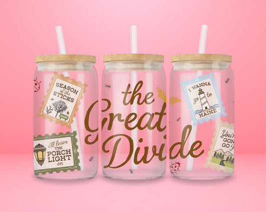 16oz glass tumbler with The Great Divide lettering and illustrated postage stamp style details