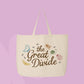 Large beige canvas tote bag featuring the words The Great Divide with illustrated butterflies, bees, snails, ladybugs, ants, and nature-inspired bug details.