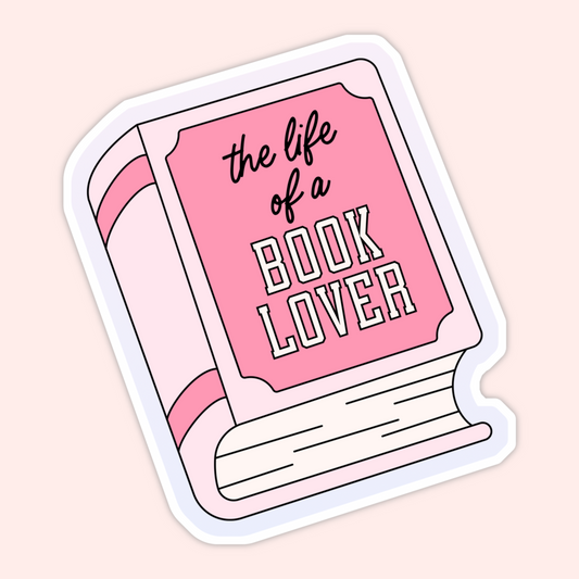 Pink illustrated book with the phrase “the life of a book lover” on the cover in a soft, girly aesthetic.