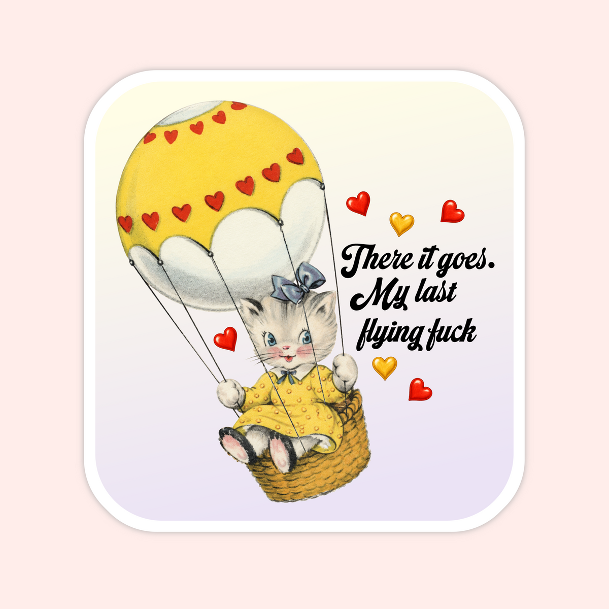 A square sticker or print with rounded corners featuring a cute illustration of a small cat in a yellow outfit sitting in a hot air balloon basket. The balloon is yellow with red heart details, and the text reads, 'There it goes.