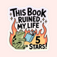 Green frog reading a book in front of flames with text that reads “This Book Ruined My Life 5 Stars.”