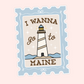 A postage stamp-style sticker or decal with a scalloped light blue border, featuring an illustrated lighthouse on a cream background with the text “I WANNA go to MAINE” in brown lettering.