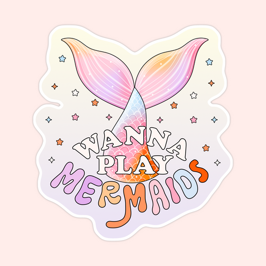 Pastel mermaid tail sticker with colourful stars and the phrase “wanna play mermaids.”
