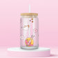 Glass can tumbler with bamboo lid and glass straw featuring pastel teapots, dice, flowers, lipstick, and a pool float girl illustration inspired by a colourful pop music video.