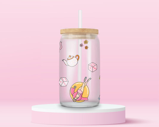 Glass can tumbler with bamboo lid and glass straw featuring pastel teapots, dice, flowers, lipstick, and a pool float girl illustration inspired by a colourful pop music video.