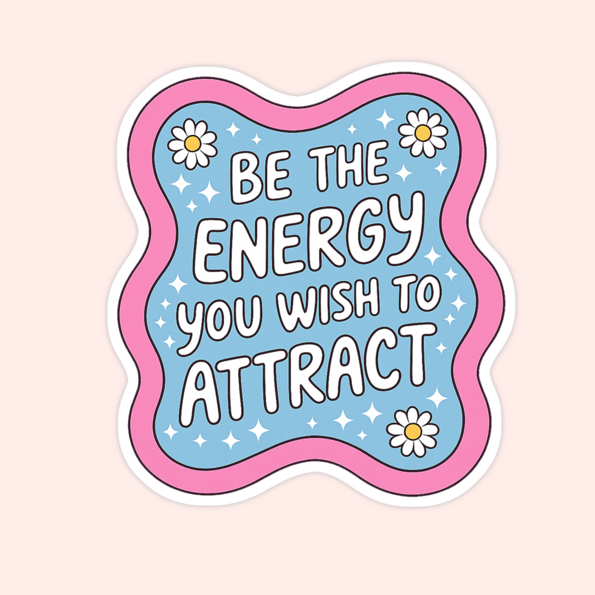 A die-cut sticker with a wavy scalloped border, featuring the motivational quote 'BE THE ENERGY YOU WISH TO ATTRACT' in white bubble letters on a light blue background with white daisies and sparkles. The sticker is presented on a solid pale pink background.